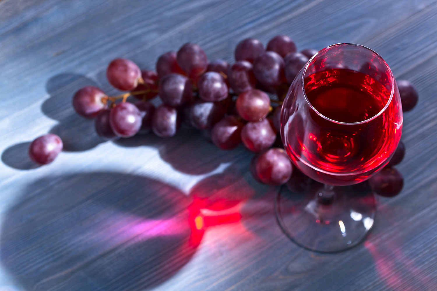 red grapes and a glass of wine
