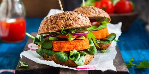 A veggie burger with avocado