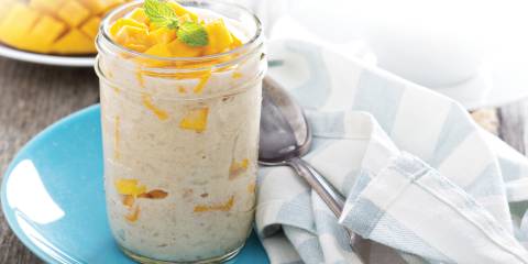 Mango coconut rice pudding in a glass cup