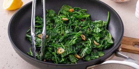 Sautéed garlic spinach in a pan. 