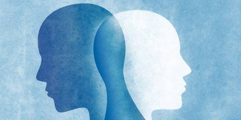 overlapping silhouettes standing back-to-back