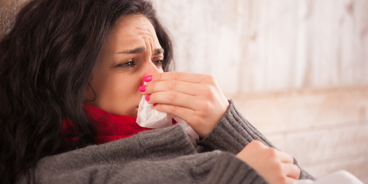 girl sick in bed with a cold