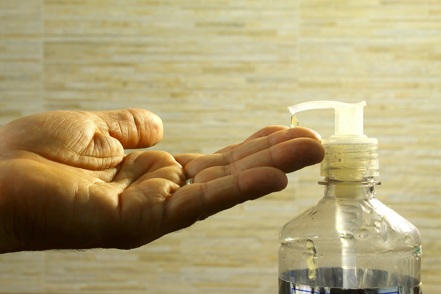 A man putting product on his hands