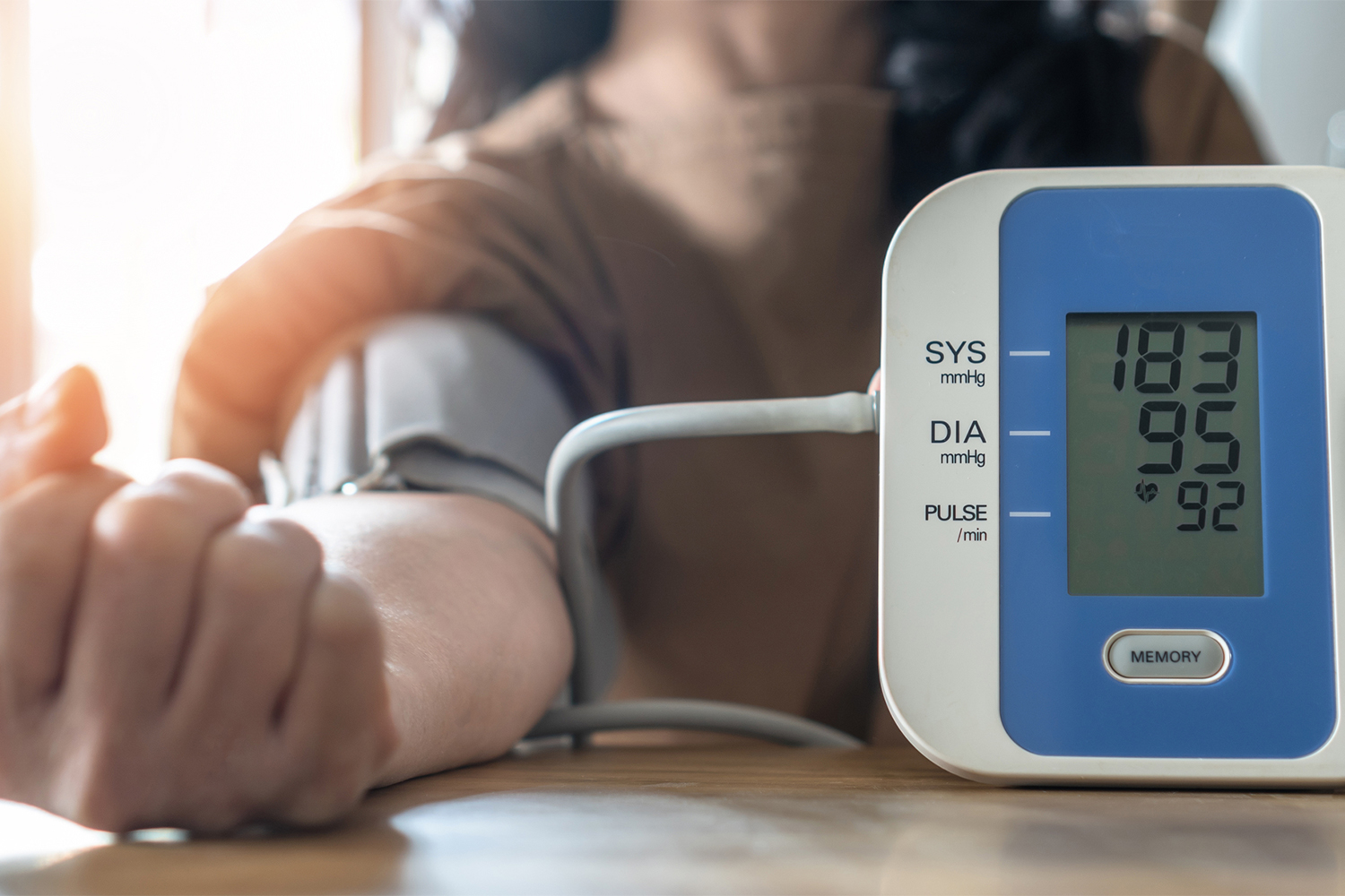 a woman checking her own blood pressure