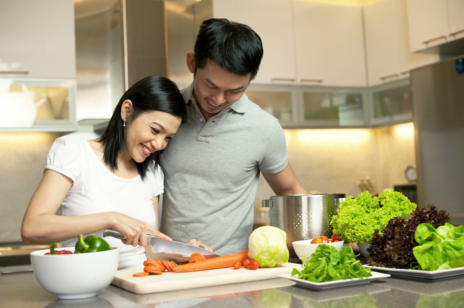 A couple preparing dinner together.