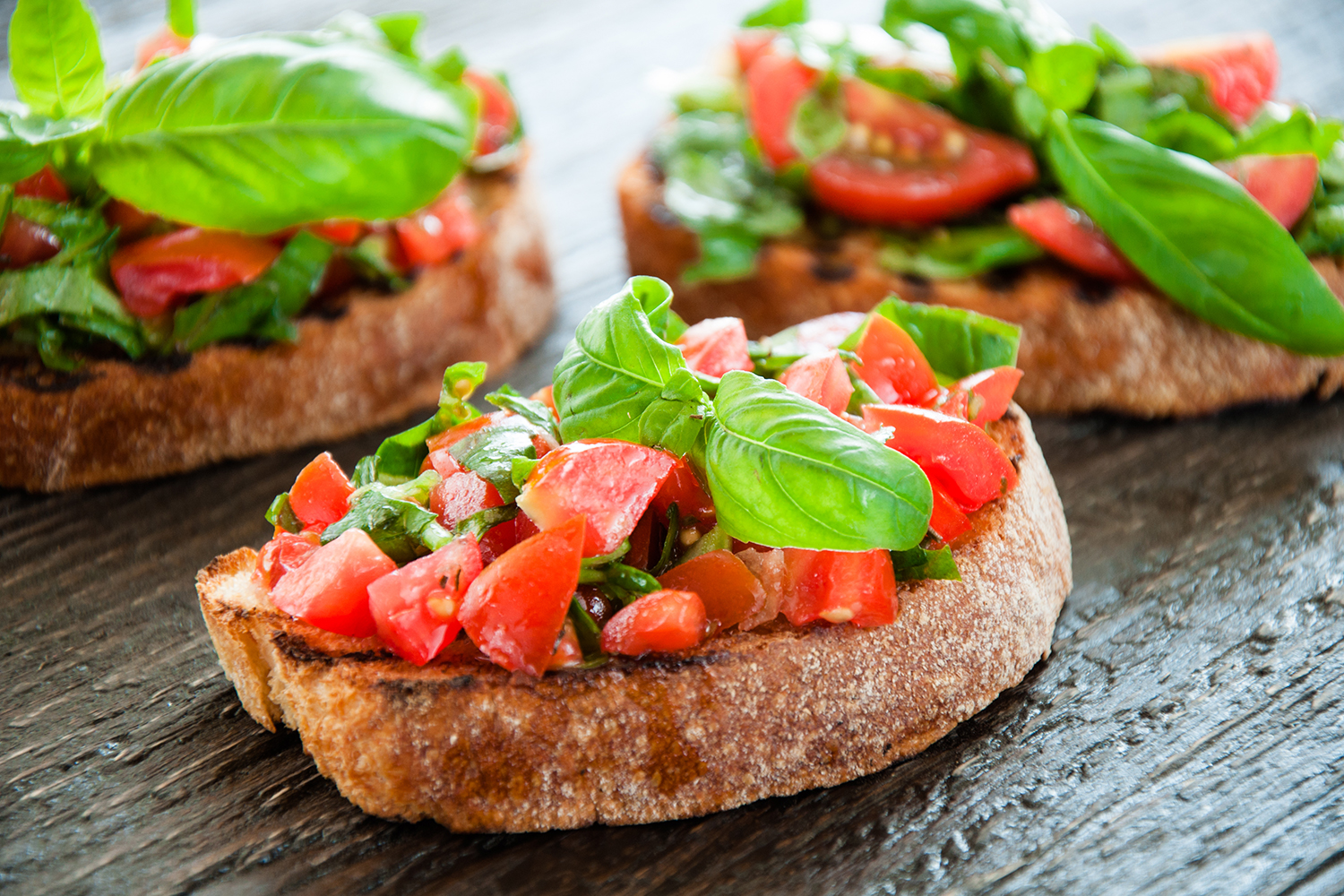 diced tomato and chopped basil on bruschetta