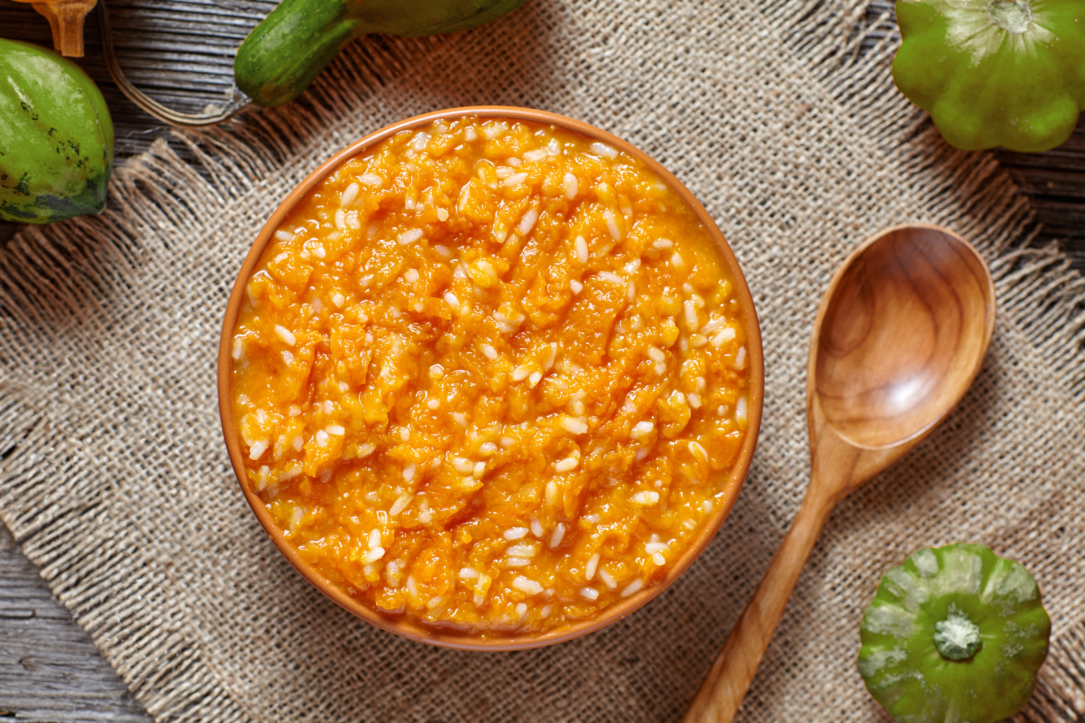 a bowl of rice pudding with squash and spices