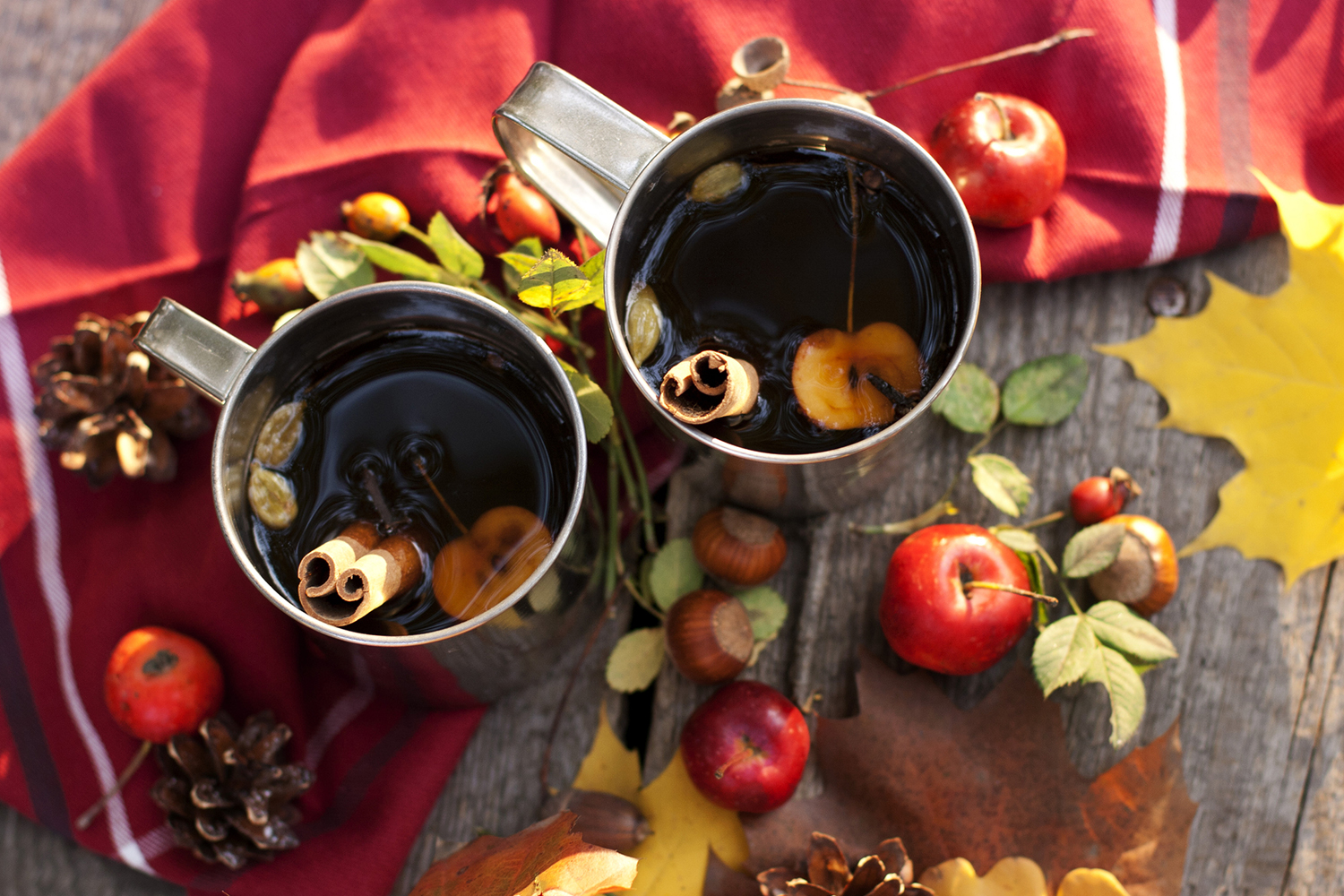 hot mugs of red tea with apple and cinnamon