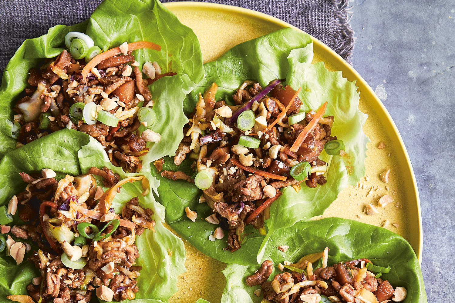 a plate of wraps with seasoned chicken