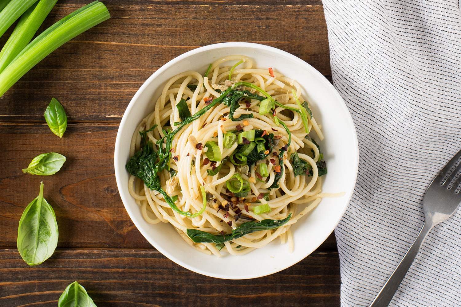 Noodles and spinach in a bowl ready to eat