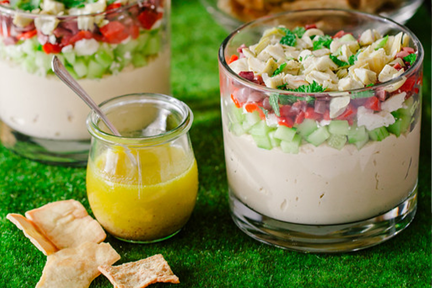 pita chips and dip along side a vinaigrette