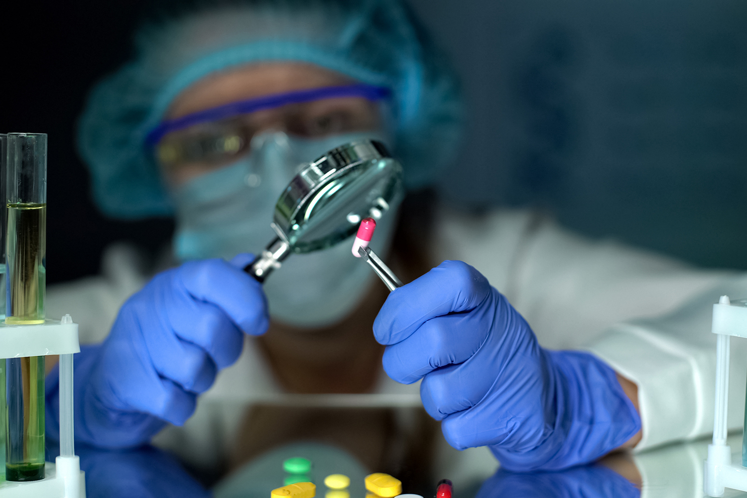 a scientist testing and examining supplements