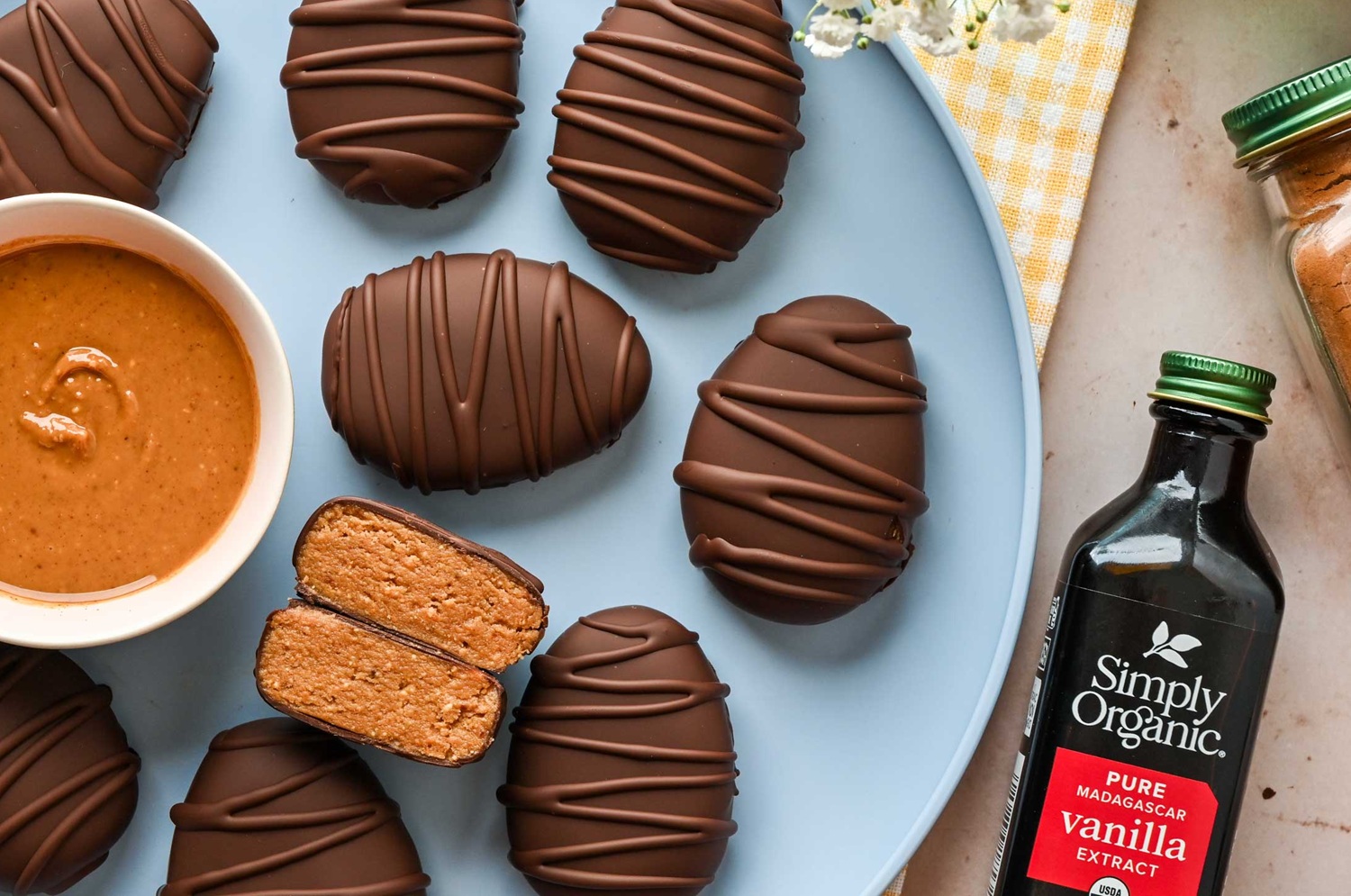chocolate peanut butter on blue plate with vanilla extract bottle