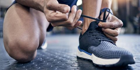 Man tying sneaker.