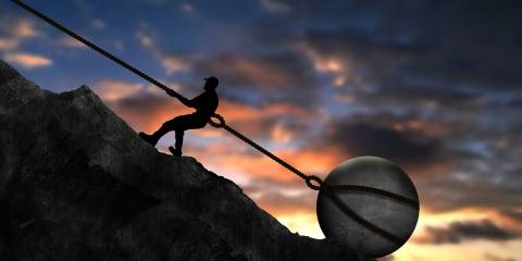 a man who stopped pushing a boulder up a mountain, and used it as an anchor for his rope