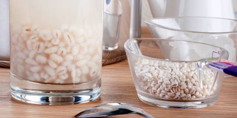 A glass of barley soaking in hot water