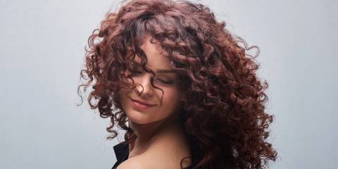a woman with luxurious curly hair