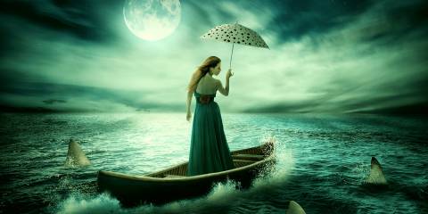 A woman drifting on a boat in stormy, shark-infested waters... but she's got great hair and a lovely umbrella.