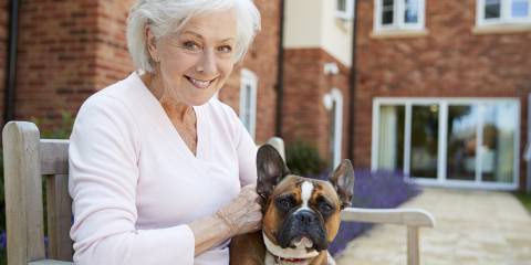 an older woman and a bulldog with sagging jowls