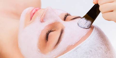 Face mask being applied to a person's face. 