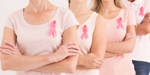 Women standing together against breast cancer