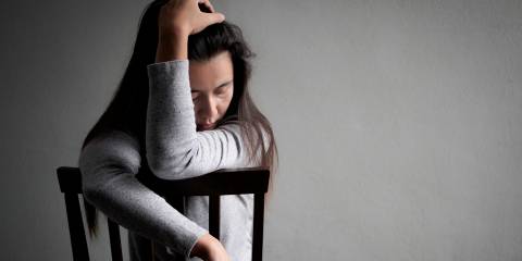 A woman slumped in a chair