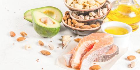 Foods full of healthy fats, like nuts, avocado, and salmon