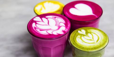 Beetroot, matcha,turmeric lattes are on the marble table.