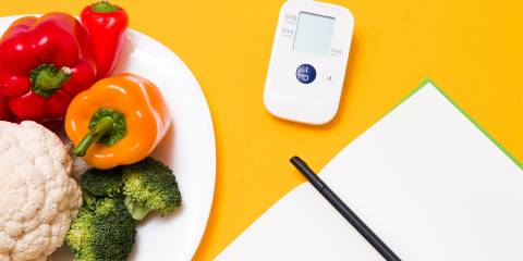 a journal, a blood pressure monitor, and a diet journal