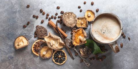 dried mushrooms, coffee beans, and a steaming cup