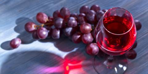 red grapes and a glass of wine