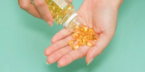 Woman with Omega 3 pills