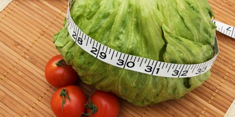 healthy foods and a tape measure for weight loss