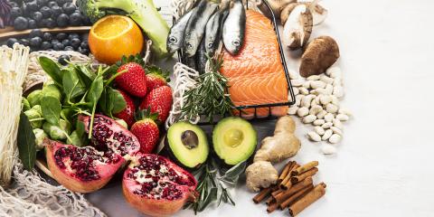 A selection of anti-inflammatory foods such as fatty fish and avocados