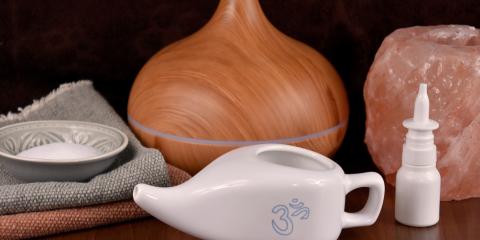 White neti pot in front of aromatherapy device.