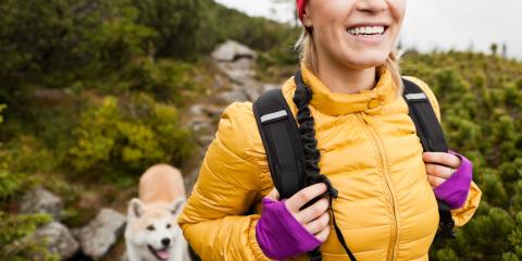woman hiking with dog