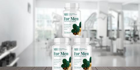 3 bottles of supplements with gym background