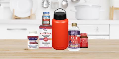 a selection of all-natural supplements and a metal water bottle
