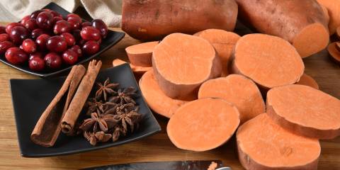 Sliced sweet potatoes, cranberries and holiday spices.