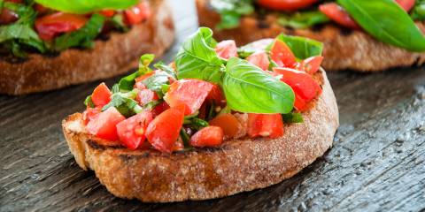 diced tomato and chopped basil on bruschetta