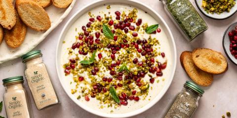 colorful dip with bottles of spices and bread