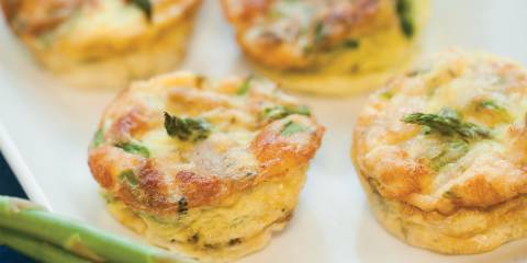 A plate of home-made mini-frittatas with asparagus, spinach, and chicken sausage