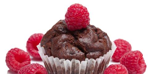 a chocolate muffin with a raspberry on top