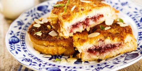 french toast with almonds and a cranberry sauce