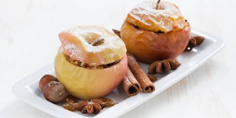 Baked apples on a white plate
