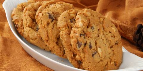 a dish of fresh chunky peanut butter cookies with chocolate chips