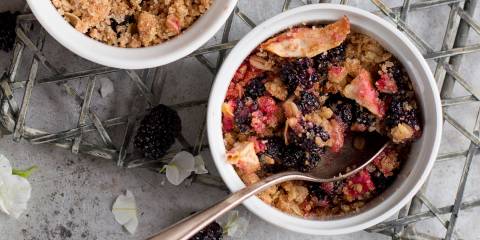 a freshly baked bowl of berry and oat crumble