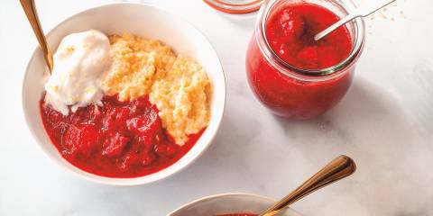 a bowl of cooked berries with cornmeal polenta and ice cream