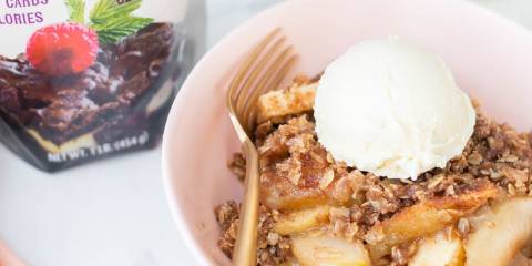 a bowl of apple crisp topped with vanilla ice cream
