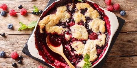 a dish of freshly baked berry cobbler